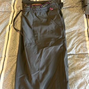 Heart & Soul scrub bottoms. Some wear & tear on the bottom